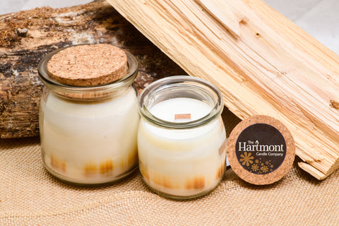 Crackling Firewood - 100% soy candle with a wood wick that crackles as it burns.  Hand painted for a unique design in each candle and hand poured for that one of a kind quality that guarantees that this Hartmont candle will fill your room with the lovely scent of a cozy, burning fire.